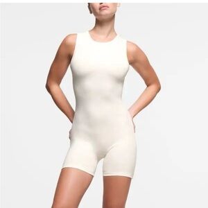 SKIMS Sleeveless Cream Bodysuit shorts